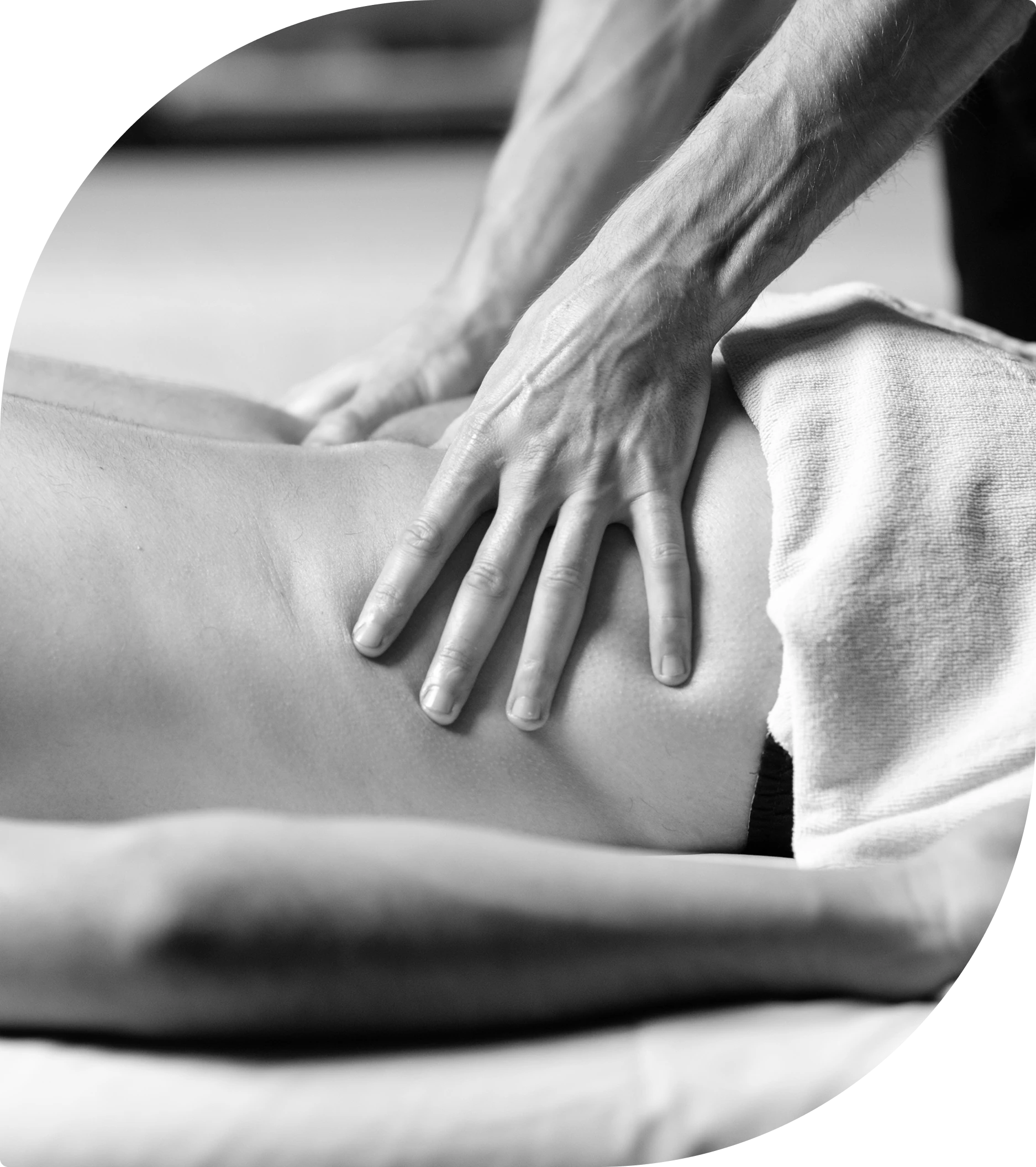 Massage therapist applying pressure on back.