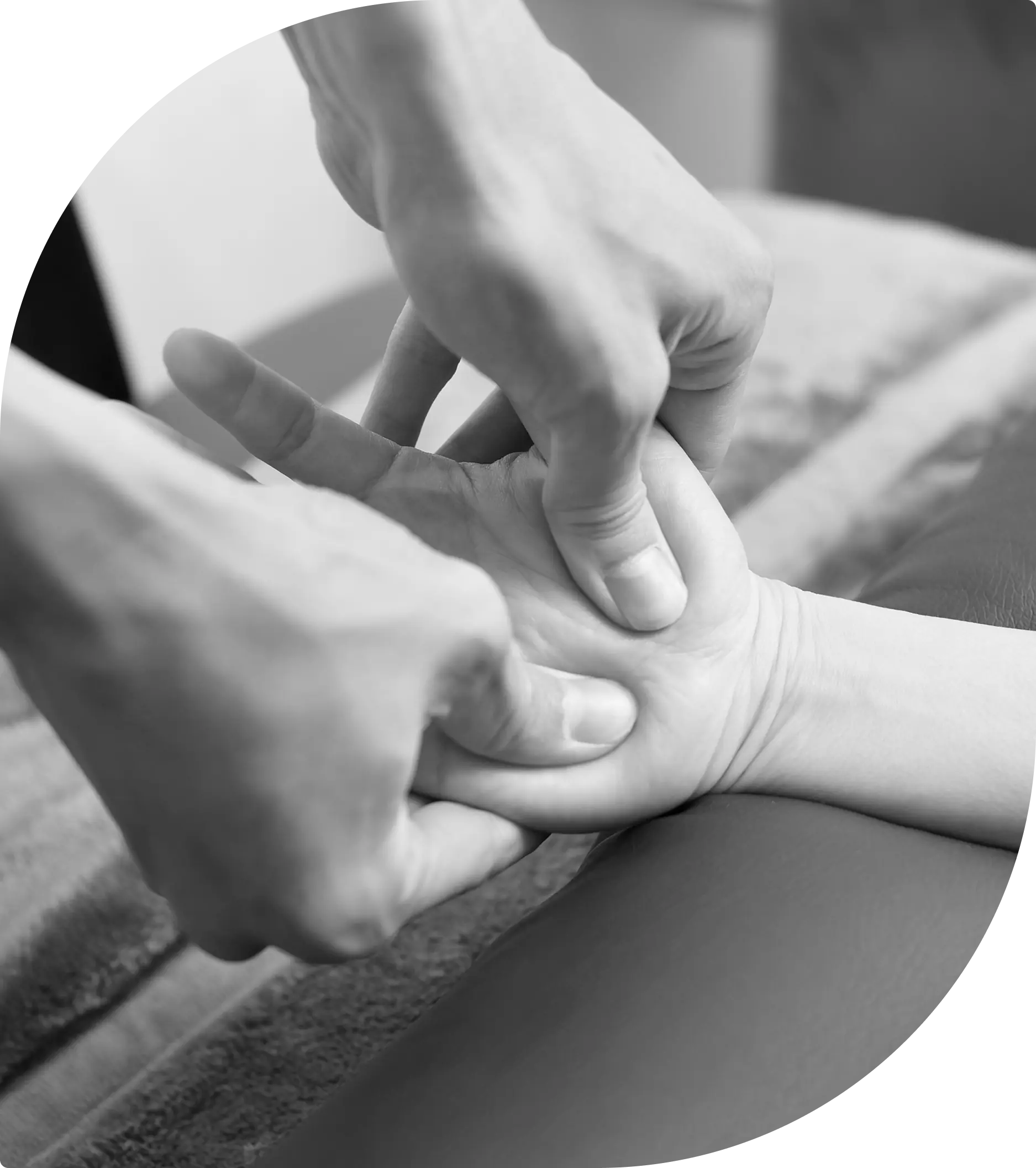 Hand receiving a massage therapy session.