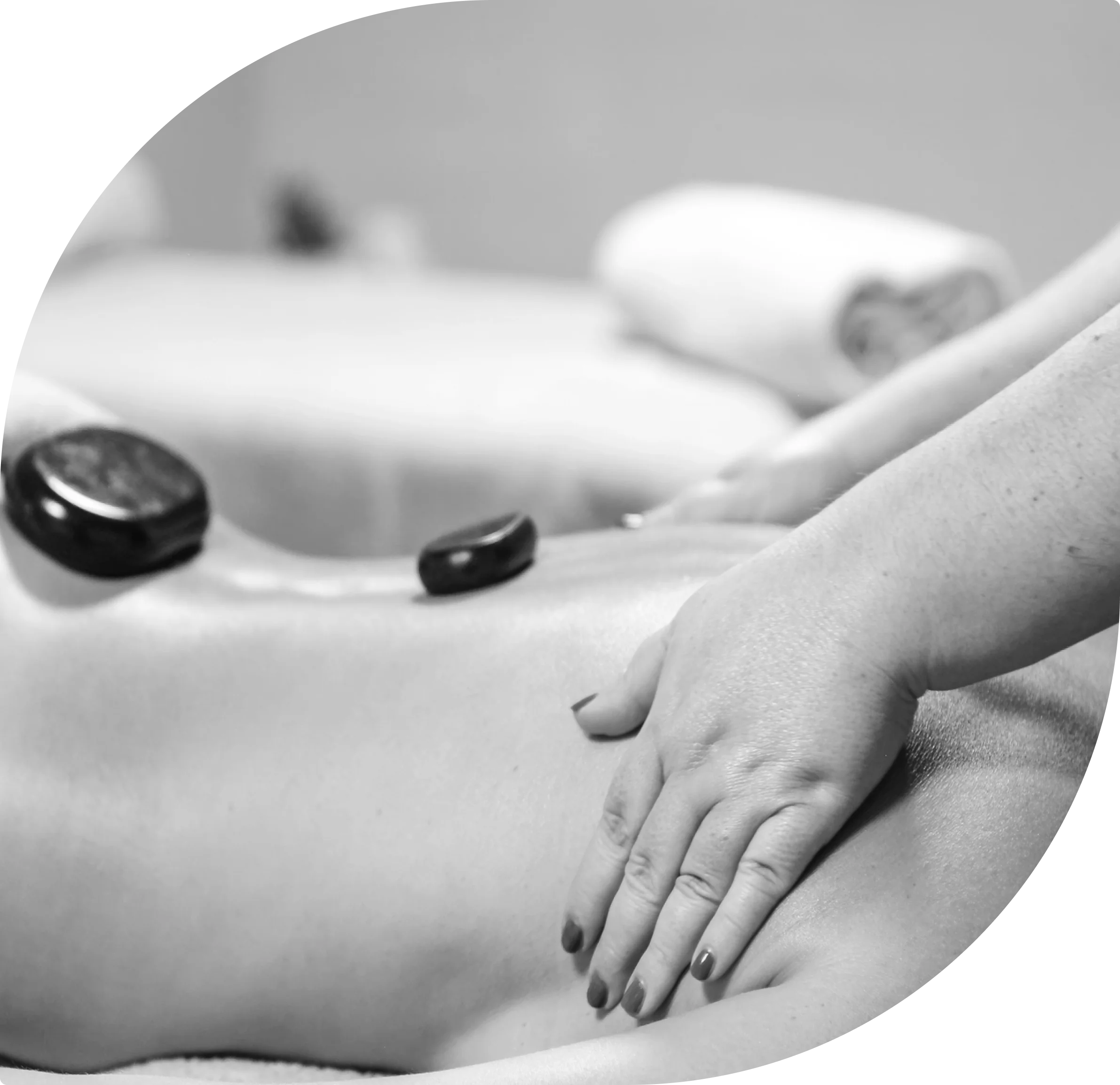Massage therapy with hot stones on back.